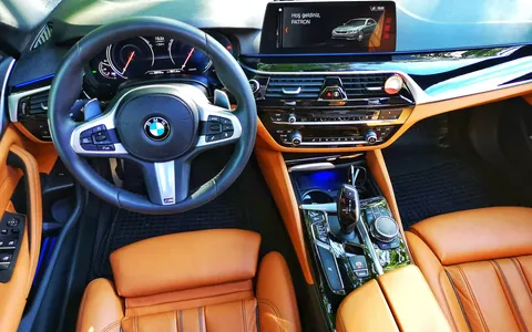 Clean tan-leather car seats and dashboard — illustrative stock photo, not Bookhelp vendors or customers