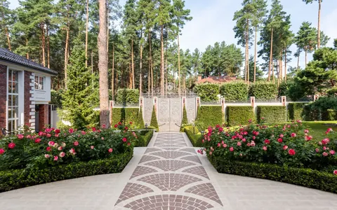 A finished garden with roses and a neat walkway — illustrative stock photo, not Bookhelp vendors or customers