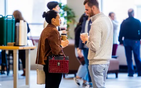 People having a welcoming service conversation — illustrative stock photo, not Bookhelp vendors or customers